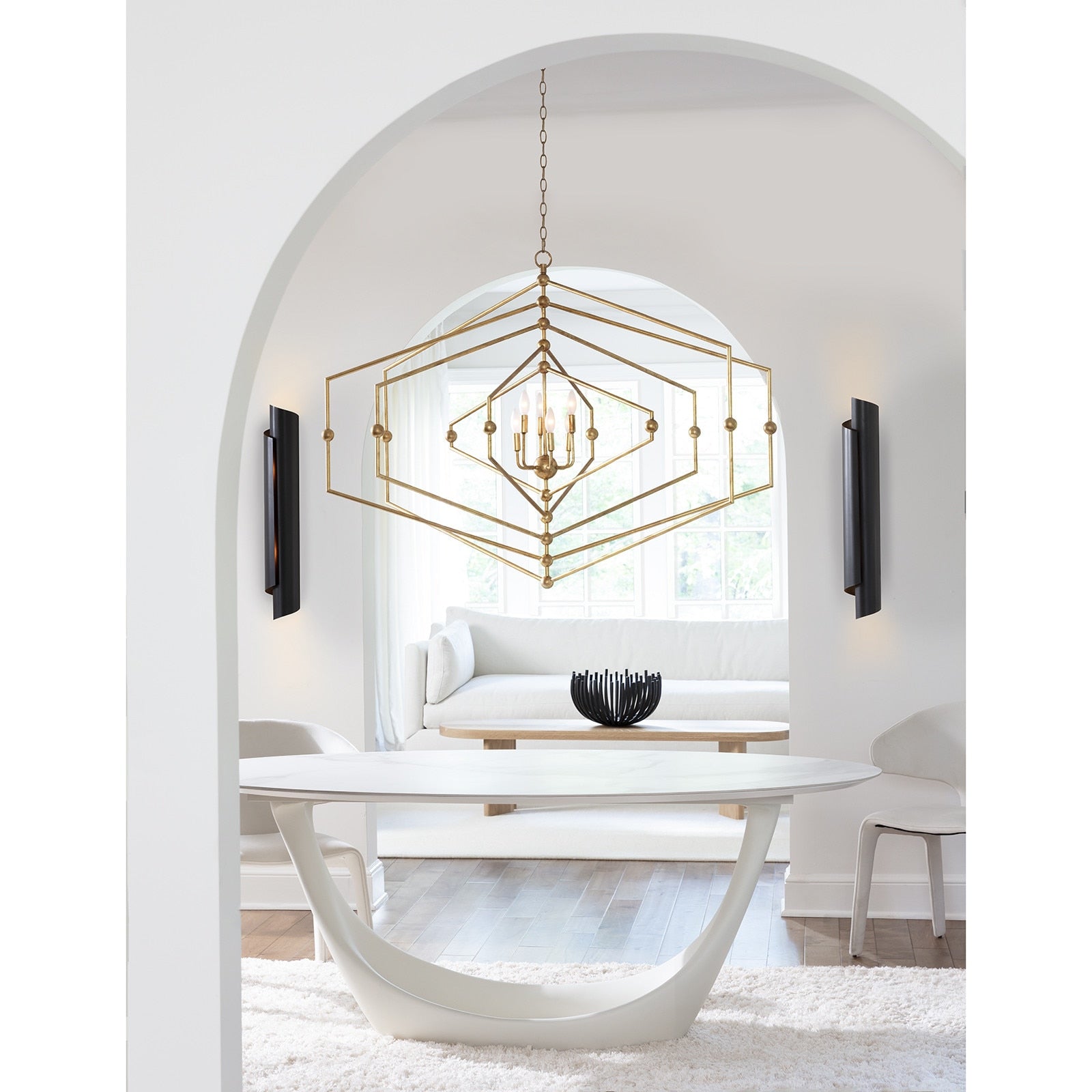 modern round table, modern brass chandelier, modern sconce, luxury dining