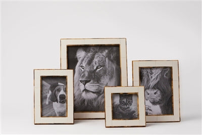 Elegant 5x7 white picture frame with a subtle gold border, perfect for tabletop or wall display.