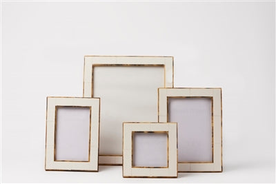 Elegant 5x7 white picture frame with a subtle gold border, perfect for tabletop or wall display.