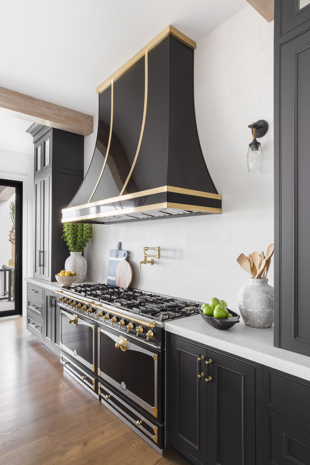 la cornue range, black and brass range hood, kitchen design, interior design