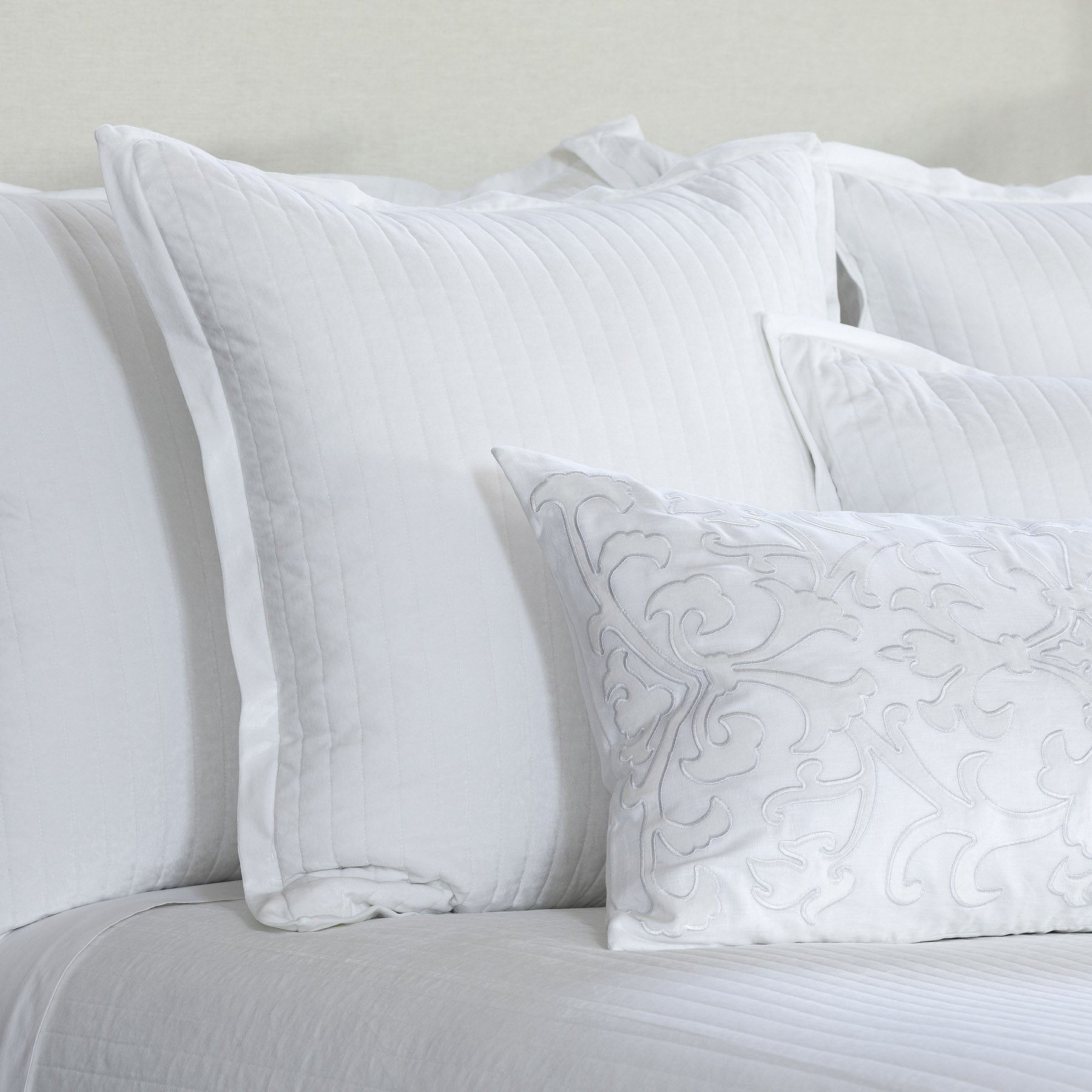 beige and white coverlet, luxury linens, white designer linens, designer bedding, bedspread, custom pillows, designer pillows